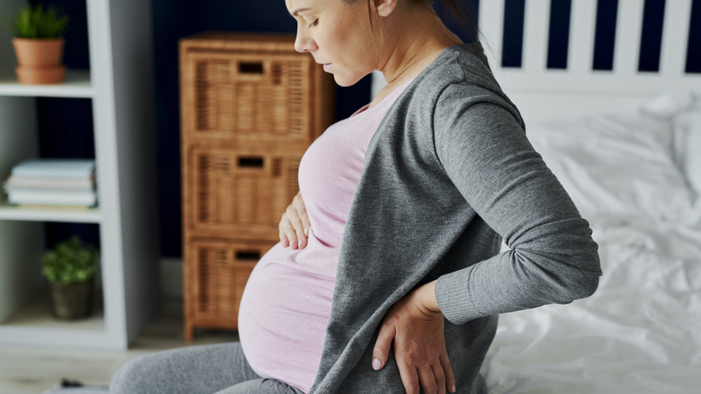 Pregnant woman feeling pain in the back