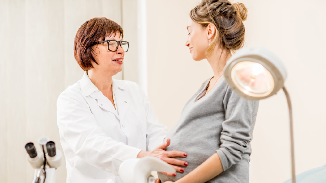 Young woman patient with gynecologist in the office