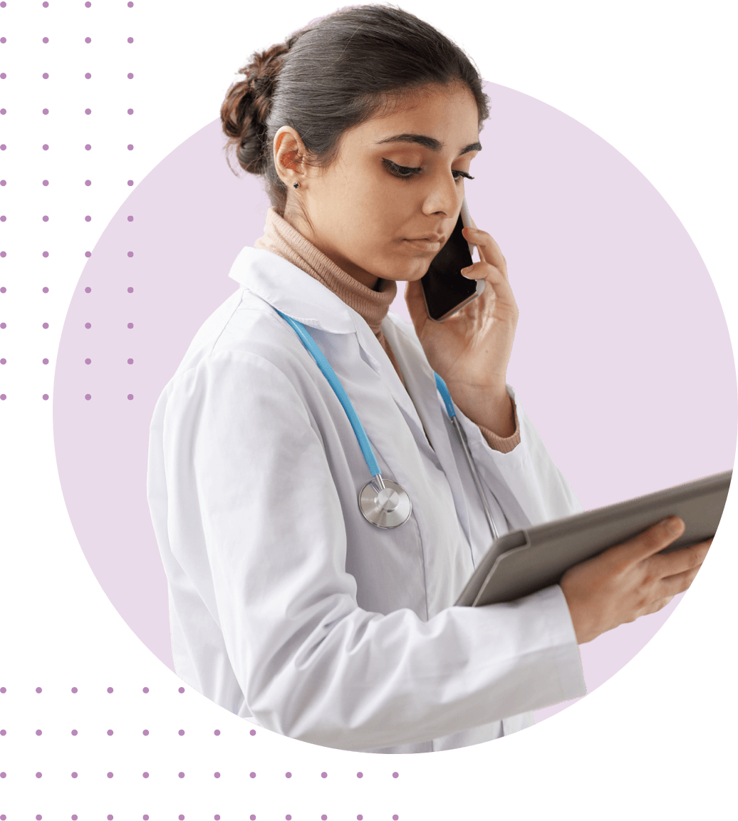doctor on the phone holding a tablet