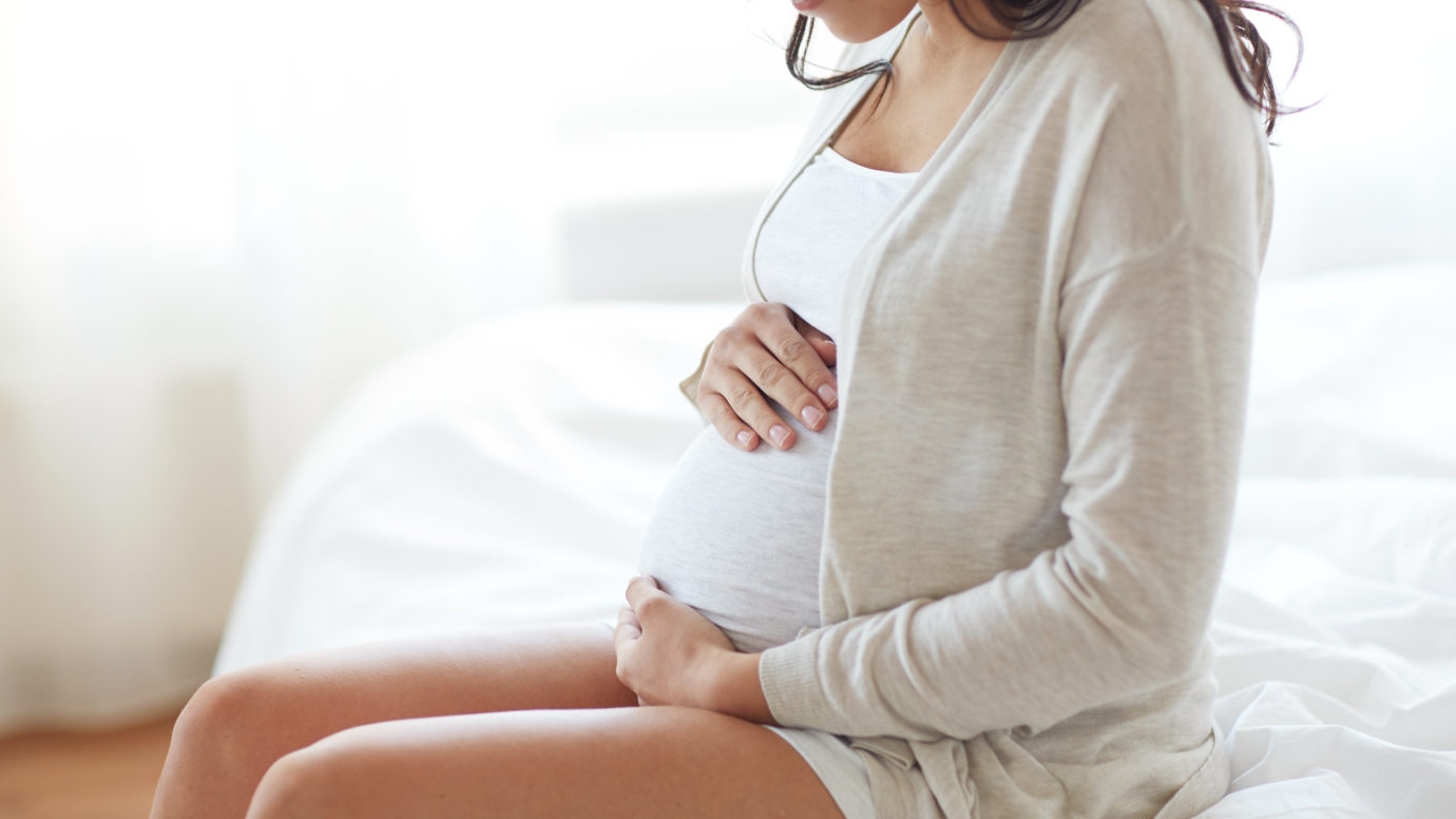 Pregnate women holding her belly