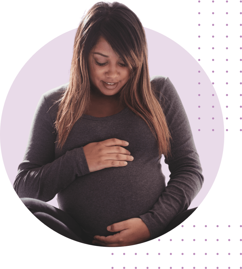 Pregnant woman holding her belly