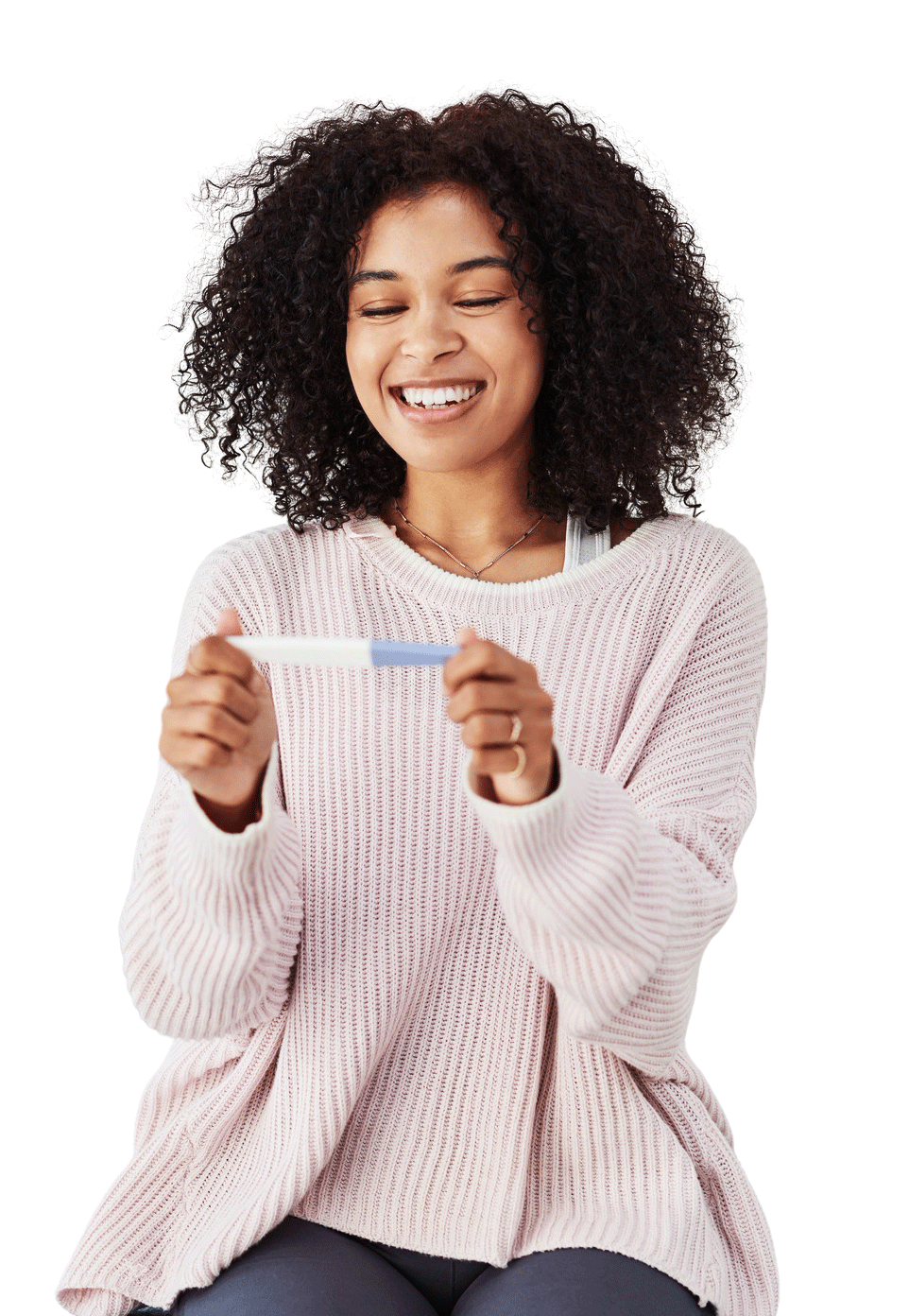 woman holding a positive pregnancy test
