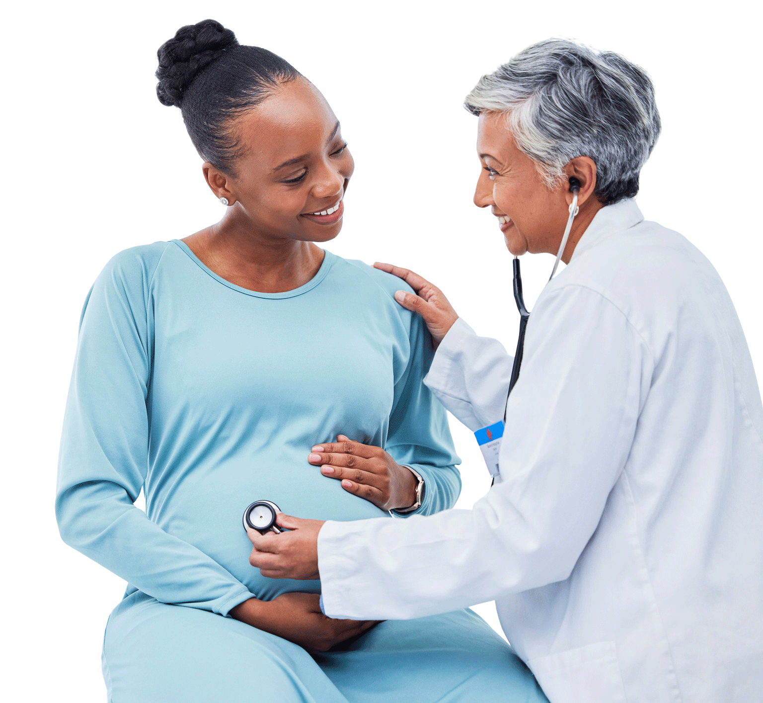 doctor touching pregnant women's belly